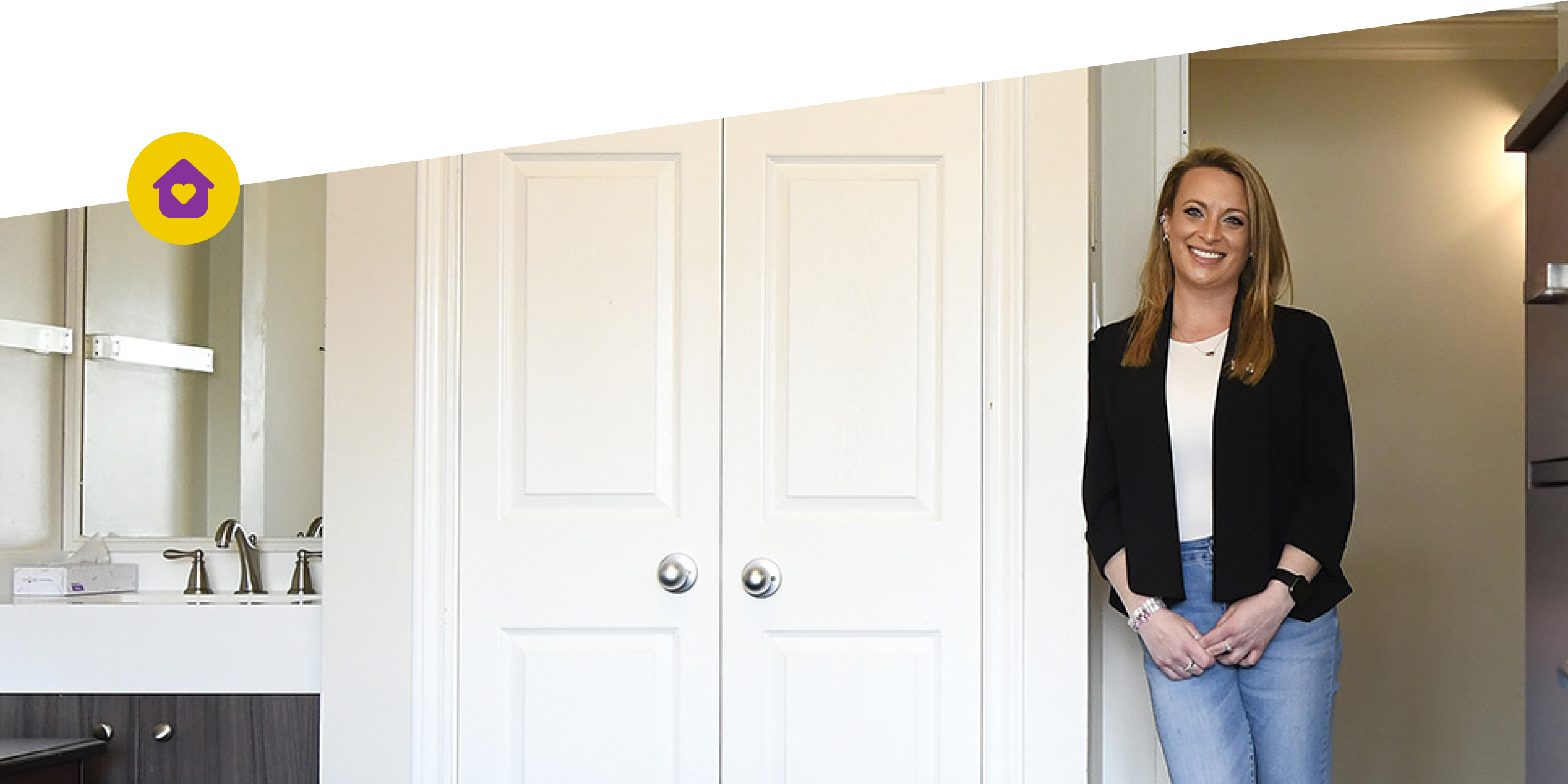 A photographic style image of one of our female alumni standing in one of our live-in treatment bedrooms.