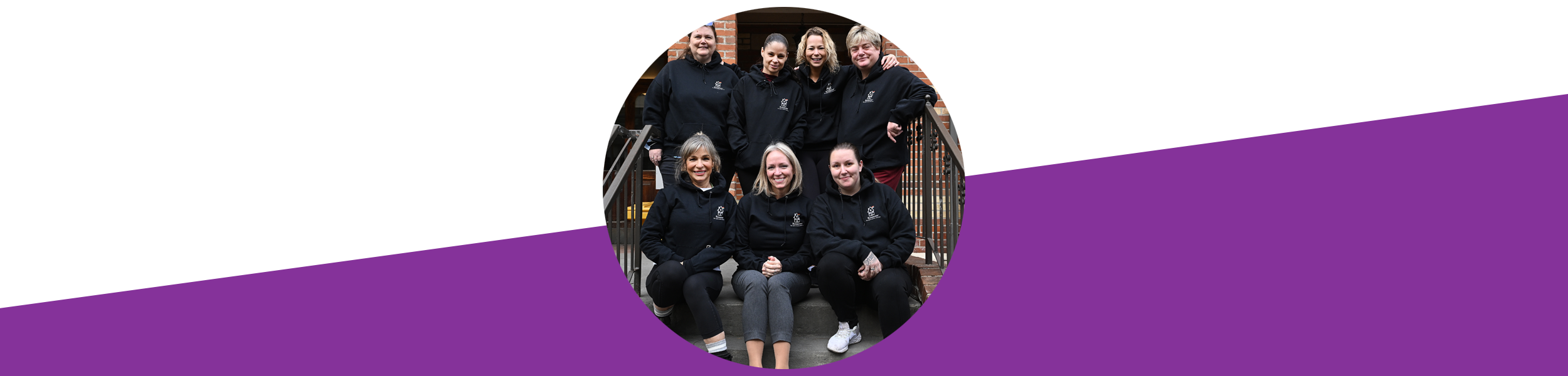 A round photographic style image of seven people all wearing our Renascent branded hoodies.